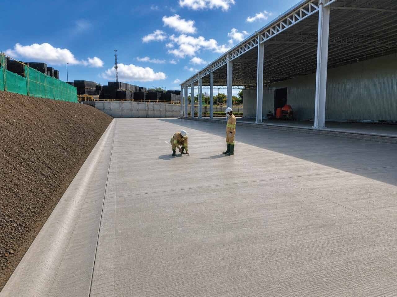 Gutari Integrated Engineering site team inspecting a finished concrete slab
