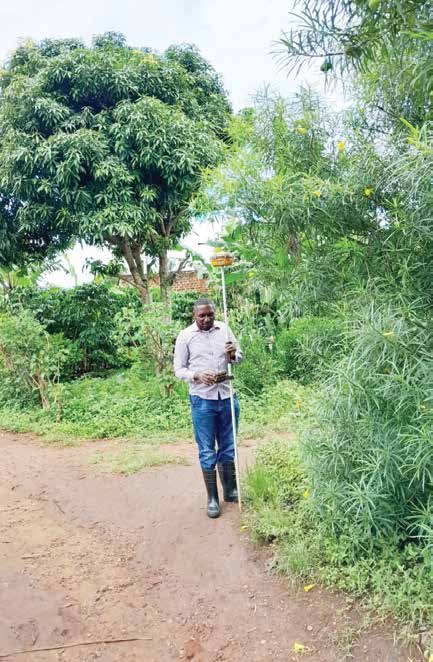 Surveyor walking a site during a ground investigation